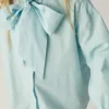 camisa_de_nia_oversize_co_2-1.webp Camisa de niña oversize con lazada azul-MINI Best Sale