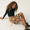 falda_corta_de_nia_con_es_0-2.webp Falda corta de niña con estampado de lunares-MINI Fashion