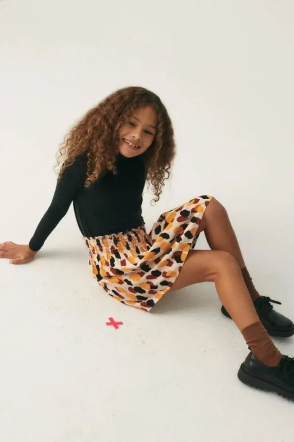 falda_corta_de_nia_con_es_0-2.webp Falda corta de niña con estampado de lunares-MINI Fashion