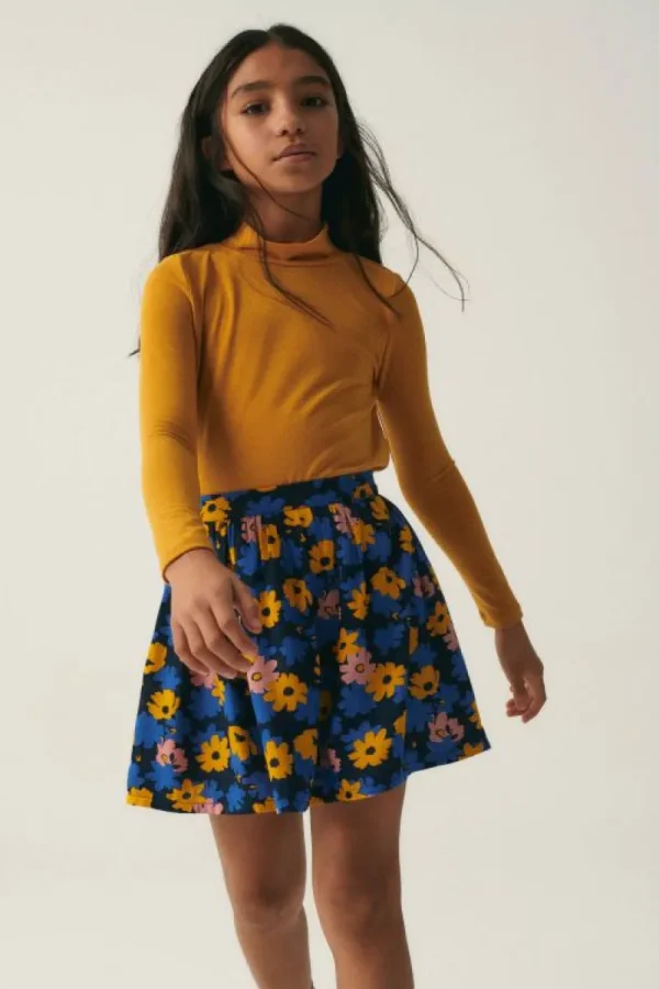 falda_corta_de_nia_con_es_0.webp Falda corta de niña con estampado floral-MINI Store