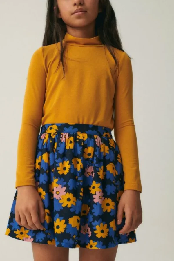 falda_corta_de_nia_con_es_2.webp Falda corta de niña con estampado floral-MINI Store