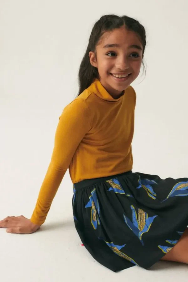 falda_corta_de_nia_en_vis_0.webp Falda corta de niña en viscosa LENZING™ ECOVERO™ con estampado de mazorcas-MINI Cheap