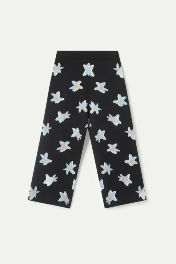 pantaln_de_nia_punto_esta_1-1.webp Pantalón de niña punto estampado floral Calatea negro-MINI Online