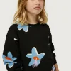 sudadera_de_nia_estampado_2.webp Sudadera de niña estampado floral Calatea negro-MINI Shop